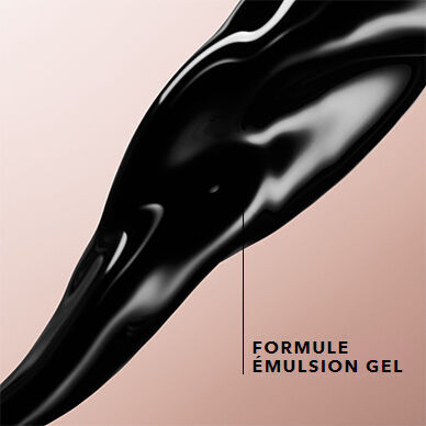 A close-up of a smooth, glossy black gel being squeezed from a tube, with a light beige background. The text “FORMULE EMULSION GEL” is displayed next to the gel.