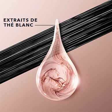 A close-up of a teardrop-shaped droplet with swirling pink and beige colors, positioned above a sleek black line on a light background, with the text "EXTRAITS DE THE BLANC" displayed next to it.