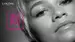 Close-up of a woman's face with short hair, highlighting her eyes and makeup. The text "Zendaya Loves BiG MASCARA" is displayed prominently in pink on the side.