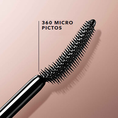 A close-up of a mascara wand featuring densely packed bristles, labeled "360 Micro Pictos," against a soft, neutral background.
