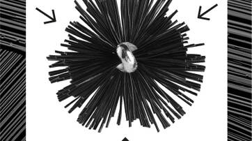 A circular arrangement of black bristles radiating from a central metallic core, with arrows pointing outward.
