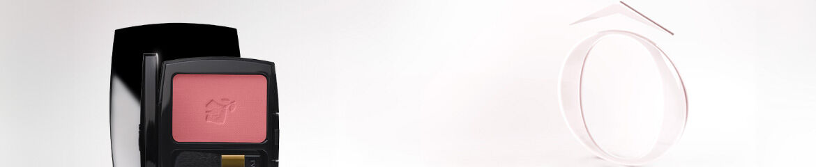 A compact blush with a soft pink shade displayed next to a minimalist white and black design element on a light background.