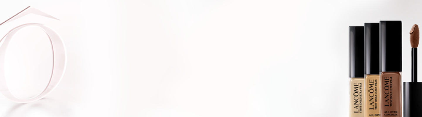 A minimalist image featuring a logo on the left and three tubes of Lancome foundation in shades from light to dark on the right.