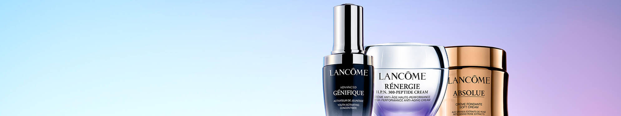 Three skincare products from Lancome displayed against a gradient background. The bottles include Advanced Genifique serum, Renergie Multi-Lift Ultra cream, and Absolue Soft Cream.